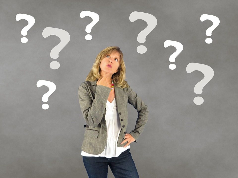 woman with question marks in the background